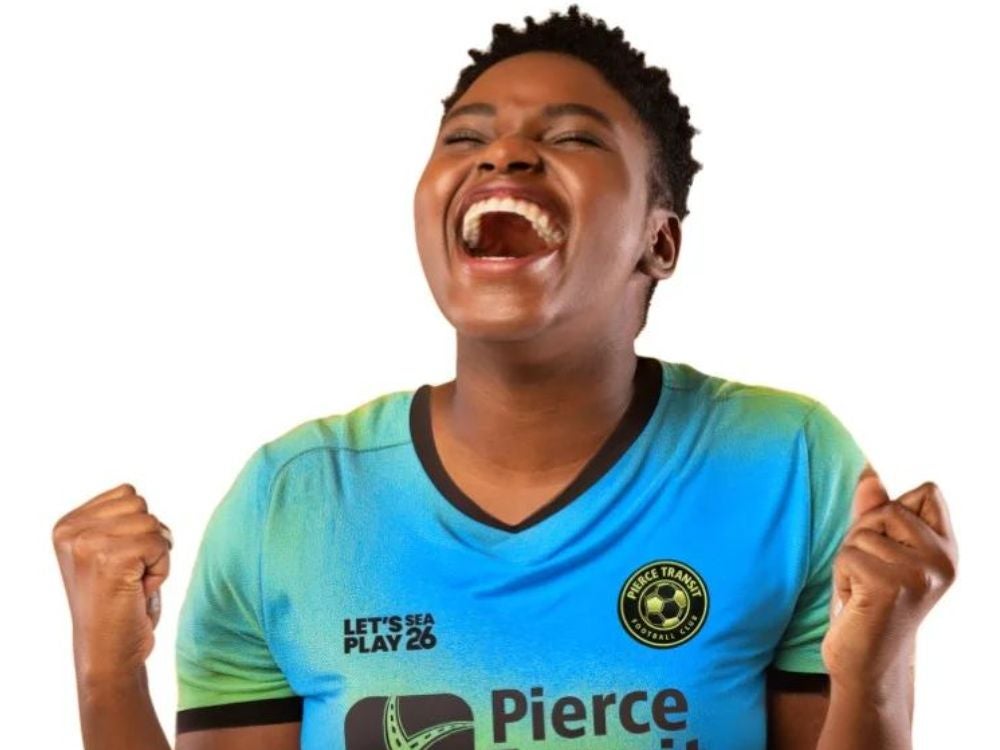 Women screaming wearing a soccer jersey